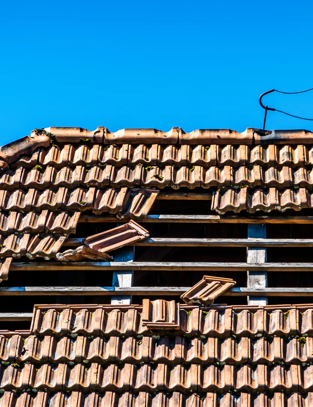 Storm damage leaving a hole in a clay tiled roof