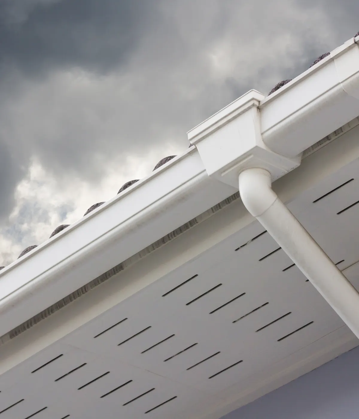 Vented white soffit boards under a roof edge