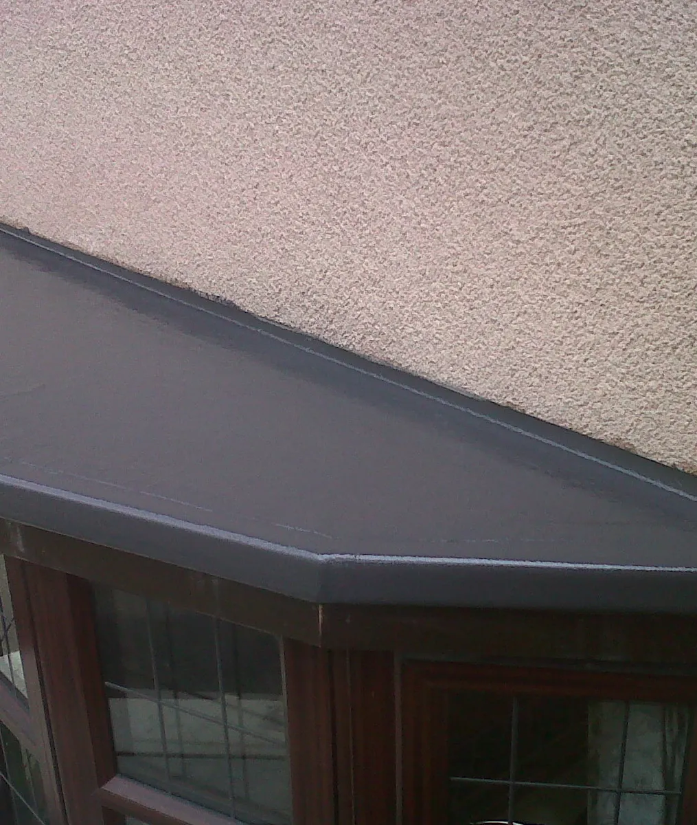 A fibreglass roof over a bay window