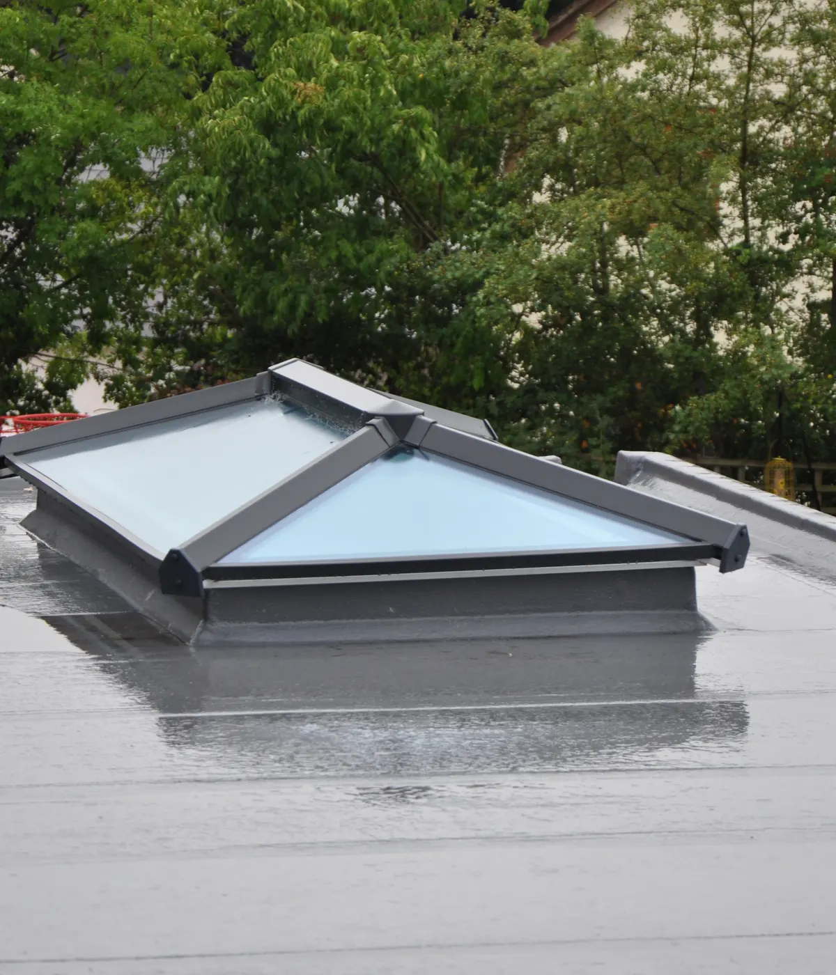 A flat roof with a glass roof lantern