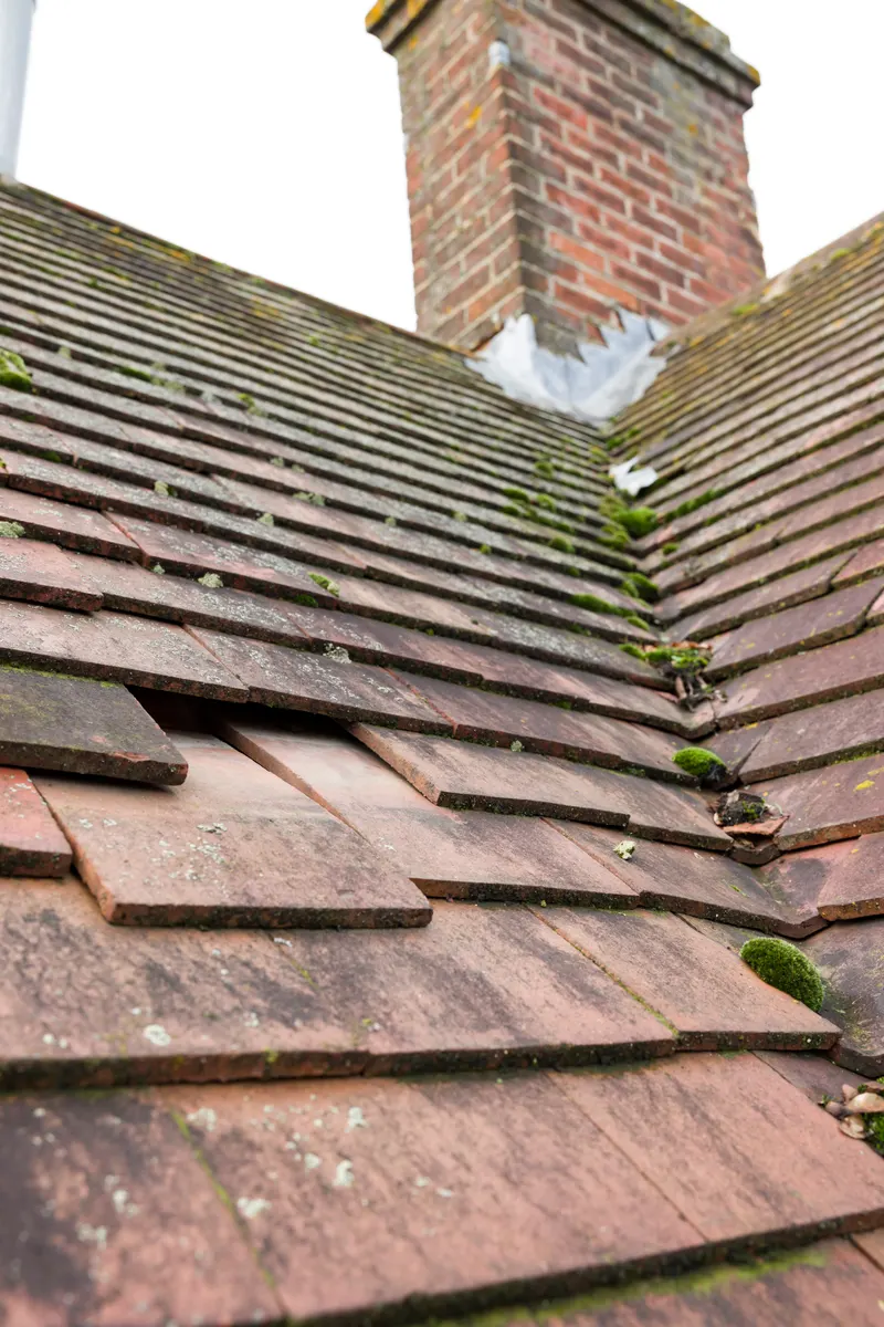 Slipped and broken roof tiles