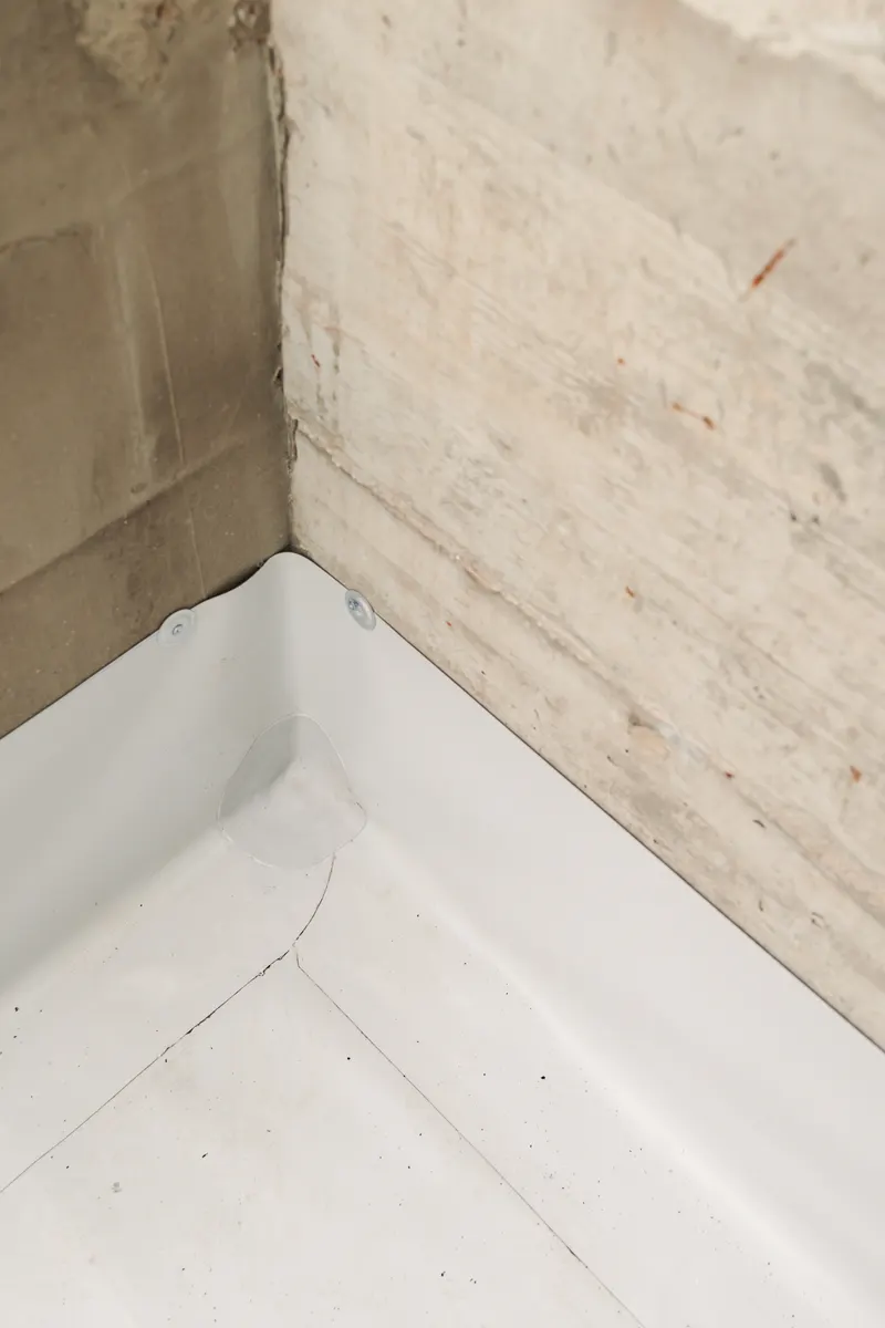 Rubber membrane dressed into the corner of an upstand